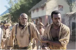  ??  ?? Louis Gossett Jr., left, stars as church leader Daddy Moses. Lyriq Bent, right, plays Chekura, the female lead’s romantic interest, in The Book of Negroes.