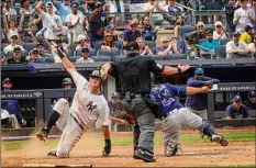  ?? Bebeto Matthews / Associated Press ?? The Yankees’ DJ LeMahieu is ruled safe at home plate in the sixth inning against the Rays on Saturday.