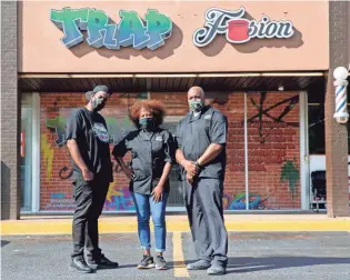  ?? MAX GERSH / THE COMMERCIAL APPEAL ?? Markeith Mccoy (from left), Monique Williams and Jason Gardner, co-owners of Trap Fusion, on Thursday, Oct. 22, in Memphis.