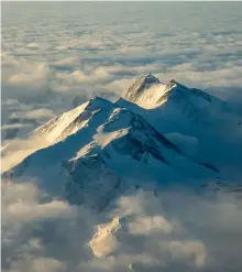  ?? ?? Mount Murchison, located in Victoria Land on the west coast of the Ross Sea, pierces the clouds.