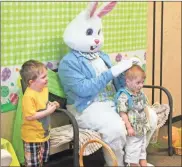  ??  ?? Volunteers served up pancakes for parents and youth alike to have fun creating a bunny face on during Brunch with the Bunny 2019. The Easter Bunny was dressed up and ready to take photos with local youth at Brunch with the Bunny at Anna Kresge Memorial United Methodist Church in Cedartown on April 13.