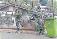  ?? ANI ?? Security personnel inspect a dustbin during a patrol after an encounter at Bhimber Gali in Poonch on Monday.