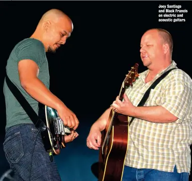  ??  ?? Joey Santiago and Black Francis on electric and acoustic guitars