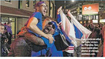  ??  ?? Fans celebrate after the Cubs’ victory on Thursday. See more celebratio­n photos at chicago. suntimes. com.