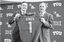  ?? LM Otero / Associated Press ?? TCU athletic director Jeremiah Donati, left, said Sonny Dykes’ experience coaching and recruiting in Texas were assets.