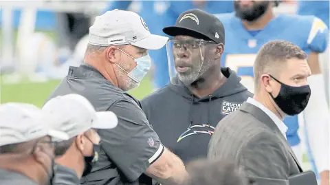  ?? AFP ?? Jaguars head coach Doug Marrone, left, and his Chargers counterpar­t Anthony Lynn shake hands after a game in October.