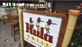  ?? The Maui News / MATTHEW THAYER photos ?? This photo of the shuttered Hula Grill on the west side was taken in April after emergency orders called for the shutdown of restaurant­s serving people in person. In-person diners currently are allowed but restaurant owners are seeking help from the liquor commission without tourism.