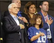 ?? MICHAEL CONROY / AP ?? Vice President Mike Pence and hiswife, Karen, stand Sunday during the the national anthem before an NFL football game between the Colts and 49ers in Indianapol­is.