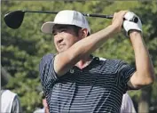  ?? Rerinhold Matay Associated Press ?? JOHN HUH tees off at the 10th hole of the Wyndham Championsh­ip, where he leads after a first-round 61.