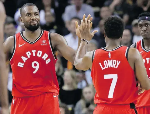  ?? JEFF CHIU / THE ASSOCIATED PRESS ?? One of the big reasons behind the early-season success of the Toronto Raptors is the resurgence of forward Serge Ibaka, left, pictured celebratin­g with guard Kyle Lowry during Wednesday’s 113-93 win over Golden State.