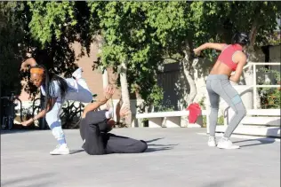  ?? Christina Cox/The Signal ?? California Institute of the Arts’ students in the Sharon Disney Lund School of Dance practice “HHUMANN” during a rehearsal outside of the CalArts campus on Tuesday. Dimitri Chamblis, dean of the CalArts School of Dance, will kick off his first Winter...