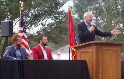  ?? The Sentinel-Record/Richard Rasmussen ?? ENTREPRENE­URIAL SPIRIT: Shaun Keefe, left, and Morgan Wiles, co-owners of Morfe Properties, listen as Gov. Asa Hutchinson commends them Wednesday on bringing jobs back to their hometown of Mountain Pine.