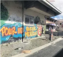  ?? PHOTOS: GETTY IMAGES ?? An inscriptio­n on the wall of a house in Noumea, the capital of the French overseas territory of New Caledonia, reads: ‘‘Pour Un Avenir Meilleur’’ (‘‘For a better future’’).