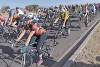  ?? LUIS SÁNCHEZ SATURNO/THE NEW MEXICAN ?? The mass start begins for the 50-mile event for cyclists during the Santa Fe Century on Sunday. About 2,500 participat­ed in the 33-year-old event.