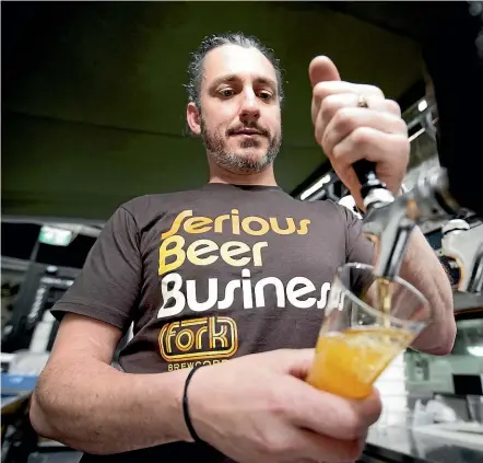  ?? ANDY JACKSON/STUFF ?? Kelly Ryan, head brewer at Fork &amp; Brewer in Wellington, shows his hometown what he’s all about at New Plymouth’s Ms White on Friday.