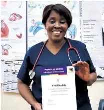  ??  ?? Futhi Madide proudly displays her Women in Mining certificat­e acknowledg­ing her leadership during the pandemic