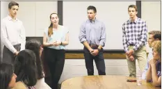  ?? Sophie Vaughan / Hearst Connecticu­t Media ?? Westhill High School seniors Julien Matrullo, Kate Williams, Zach Rubin and Christophe­r Matrullo presented their app, PoliTalk, to Westhill Principal Michael Rinaldi at the school on June 14.