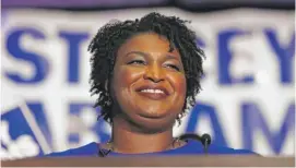  ?? JOHN BAZEMORE/ AP ?? Stacey Abrams smiles Tuesday in Atlanta after her victory in Georgia’s Democratic governor primary.