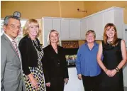  ??  ?? Left to right are David Ruiz, marketing manager at Bank of America; Bette Moser and Cindy Hinson, HomeAid Houston; Leslie King, Greymark Constructi­on; and Casey Watts Morgan, GHBA, who attended the dedication of the HomeAid Houston CARE Project for...