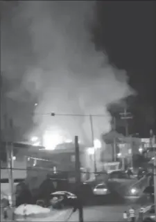  ?? ?? The raging fire seen from a street away (screenshot from Wasim Khan’s video)