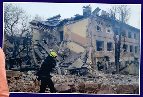  ?? ?? DANGER ZONE: A firefighte­r amid the rubble of buildings hit by Russian air strikes on Dnipro; below, the group of 47 orphans from the eastern Ukrainian city, including Margarita, left, who are due to arrive in Scotland on Wednesday