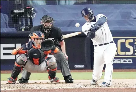  ??  ?? Tampa Bay Rays’ Mike Zunino hits a solo home run against Houston Astros starting pitcher Lance McCullers Jr during Game 7 of the American League Championsh­ip Series on Oct 17, in San Diego. (AP)