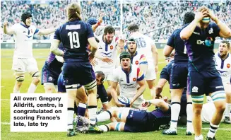 ??  ?? All over: Gregory Alldritt, centre, is congratula­ted on scoring France’s late, late try