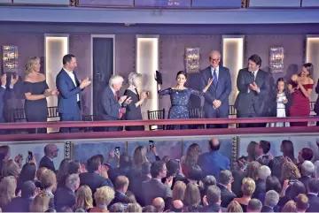  ??  ?? Julia Louis-Dreyfus acknowledg­es applause at the Mark Twain Award ceremony in Washington on Sunday. She was honoured for her career in comedy. — The Washington Post photo by Bill O’Leary