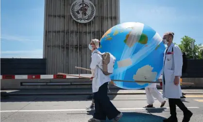  ??  ?? Doctors for Extinction Rebellion demonstrat­e in front of the World Health Organizati­on in Geneva earlier this year. Photograph: Fabrice Coffrini/AFP/Getty Images