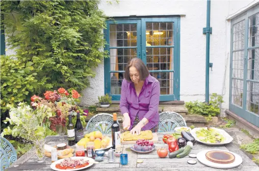  ?? LAUREN FLEISHMAN/THE NEW YORK TIMES PHOTOS ?? Prolific cookbook author Claudia Roden at her London home Oct. 26. Roden, 85, has helped revolution­ize the way the British cook and eat.