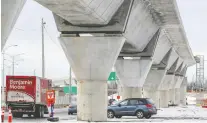  ?? JOHN MAHONEY ?? Cars pass under the REM tracks in Kirkland. The city believes the best way to integrate the proposed REM de l'est project into the downtown landscape is to bury the tracks, rather than build elevated rails.