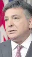  ??  ?? Ontario Finance Minister Charles Sousa: “There are those who go into new developmen­ts, buy up a slew of properties, and then flip them, while avoiding paying their fair share of taxes.”