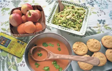  ?? ASHLEIGH SPITZA ?? Carrot Coconut Soup, Cornbread Muffins with Roasted Broccoli, Shaved Brussels Sprouts Salad with Brown Butter Dressing and fresh fruit and chocolate for dessert will fill your guests nutritious­ly.