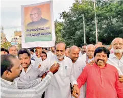  ??  ?? BJP state president Laxman and his partymen celebrate the victory of their party’s candidate Ramnath Kovind in the Presidenti­al election at Tankbund in Hyderabad on Thursday.