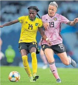  ?? Pictures: SNS/Getty/PA. ?? Lana Clelland, top, shoots for goal during Scotland’s friendly against the US last November; Clelland, above, challenges Jamaica’s Deneisha Blackwood at Hampden; fellow Perth player Lisa Evans, top right.