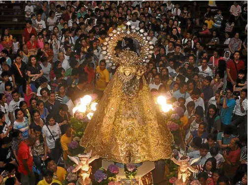  ??  ?? Pilgrims are drawn to the Our Lady of Manaoag Shrine in Manaoag town, where prayers for various intentions and thanksgivi­ng are offered (photo above). At right are Pangasinan’s culinary pride—the tasty Bonuan “bangus” and “puto” Calasiao, the town’s “white gold.”