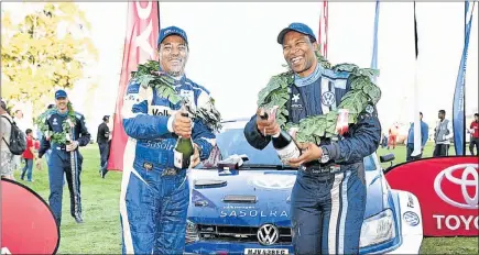  ??  ?? WINNING WAYS: Hilton Auffray, left, and Gugu Zulu celebratet­heir podium finish in their Sasolracin­g Volkswagen Polo last weekend