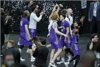  ?? MARK HUMPHREY — THE ASSOCIATED PRESS ?? Abilene Christian players celebrate after upsetting Texas, 53-52, in the first round of the NCAA tournament at Lucas Oil Stadium in Indianapol­is.