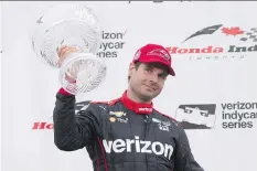  ?? CHRIS YOUNG/THE CANADIAN PRESS ?? Australian driver Will Power celebrates winning the Honda Indy Toronto Sunday.