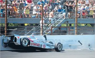  ?? Photo: PHOTOSPORT ?? Sudden impact: Scott Dixon crashes out of the Indy 500 yesterday.