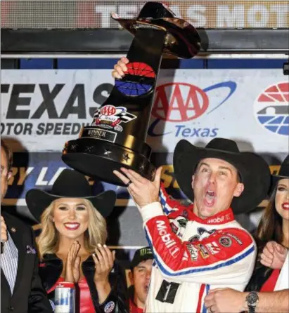  ?? ?? Kevin Harvick celebrates in Victory Lane after winning at Texas Motor Speedway on Sunday.