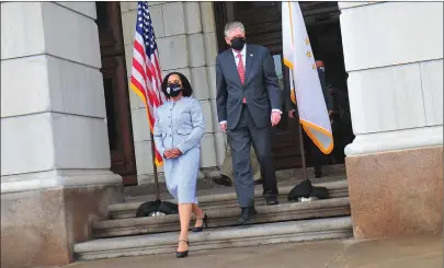  ?? Photo by Ernest A. Brown ?? Gov. Dan McKee, right, walks out of the Rhode Island State House Wednesday to announce Providence City Council President Sabina Matos as his nominee for Rhode Island lieutenant governor on the steps of the State House.