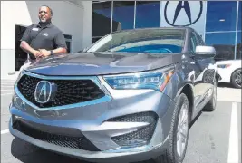  ?? Findlay ?? Findlay Acura sales consultant John Williams shows off the 2019 Acura RDX at the dealership situated in the Valley Automall.
