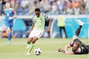  ??  ?? Nigeria’s Ahmed Musa dribbles past Iceland goalkeeper to score Super Eagles first goal during their Group D match at the Russia 2018 FIFA World Cup at Volgograd on June 22, 2018