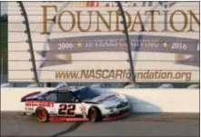  ?? CHARLIE NEIBERGALL — THE ASSOCIATED PRESS ?? Sam Hornish Jr. sits in his car after hitting the wall during the NASCAR Xfinity Series race Saturday night at Iowa Speedway in Newton, Iowa.