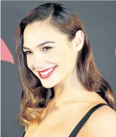  ?? MARCO UGARTE/AP FILES ?? Israeli actress Gal Gadot poses for photos during a press conference to promote the movie: Batman v Superman: Dawn of Justice in which she plays the roles of super heroine Wonder Woman, and secret alter-ego Diana Prince, in Mexico City, on March 19,...