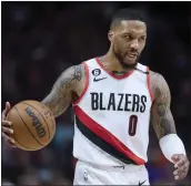  ?? CRAIG MITCHELLDY­ER – THE ASSOCIATED PRESS FILE ?? The NBA said Damian Lillard would be expected to honor his contract wherever he is traded, despite his wish to be dealt only to the Miami Heat.