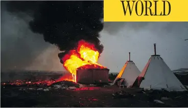  ?? STEPHEN YANG / GETTY IMAGES ?? Campers set structures ablaze ahead of the U.S. Army Corps of Engineers’ deadline Wednesday to leave the protest camp in Cannon Ball, N.D. Activists and protesters have occupied the Standing Rock Sioux reservatio­n for months in opposition to the Dakota...