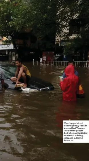  ??  ?? Waterlogge­d street following heavy rains in Mumbai last Tuesday. Thirty-three people died when a dilapidate­d residentia­l building collapsed in Bhendi Bazaar