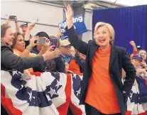  ?? MIKE GROLL/THE ASSOCIATED PRESS ?? Democratic presidenti­al candidate Hillary Clinton arrives for a rally in Syracuse, N.Y., on Friday, starting a nostalgic tour of her greatest economic hits.